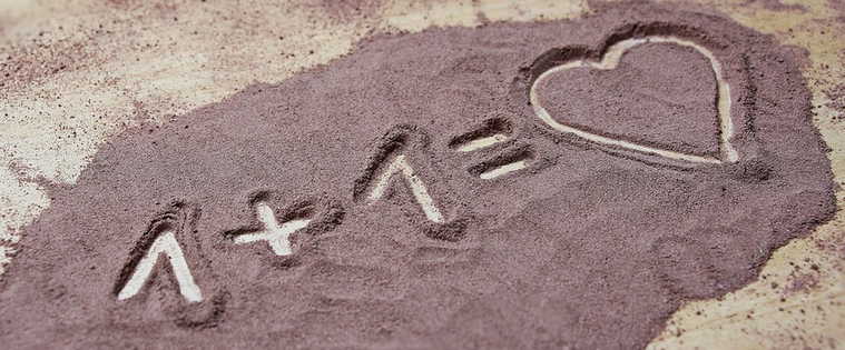 Draw heart in sand